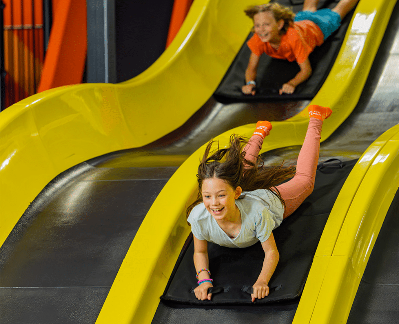 Two kids having fun at Sky Zone with BOGO ticket deals